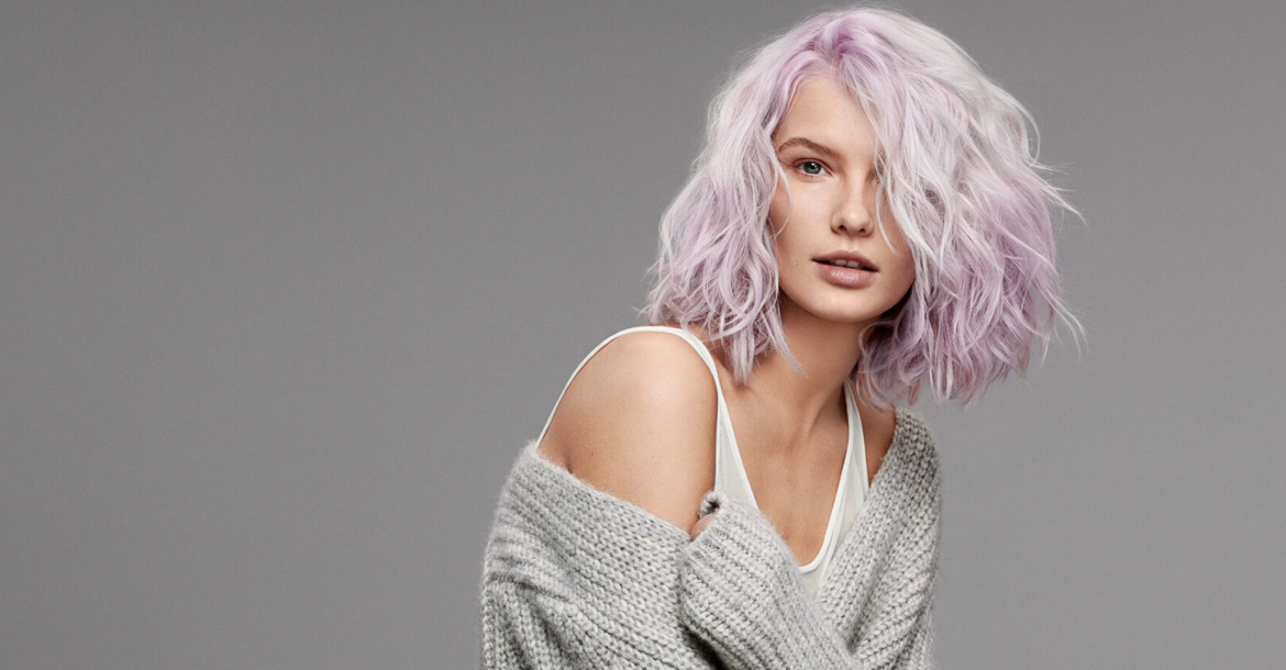 Goldwell female model with wavy hair shades of lilac